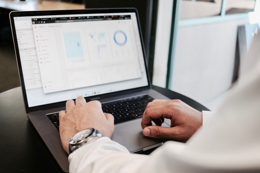 data scientist analyzing charts